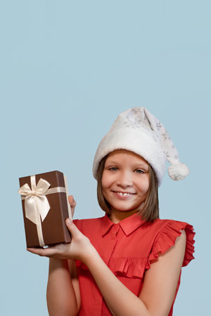 Smiling happy girl with a Christmas gift. holidays and events. Christmas.の写真素材