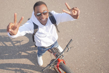 A smiling man with a bicycle. An active lifestyle. sports and recreation.の写真素材