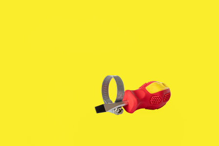 A screwdriver. Clamp. A working tool. Repair and construction. Copy space.の写真素材