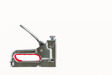 A construction stapler. A tool for repair and construction. A working tool.の写真素材