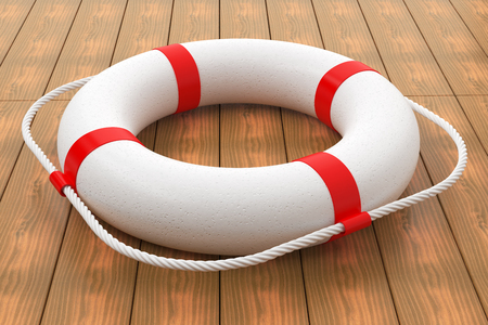 Lifebuoy on wood floor の写真素材