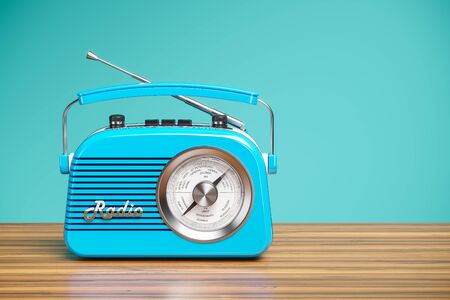 Vintage blue radio receiver on wood table. Wallpaper 3dの写真素材