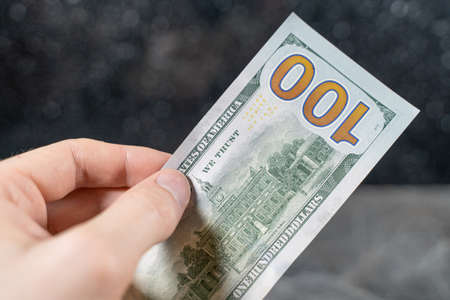 dollars in the hands of a white man