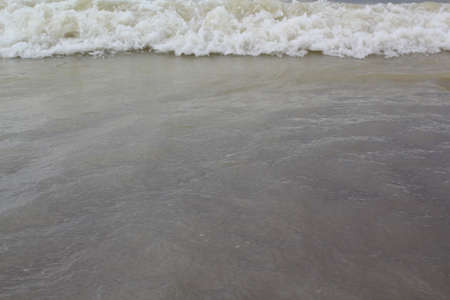 Ocean waves on the shore. Close-up of sea water.の写真素材