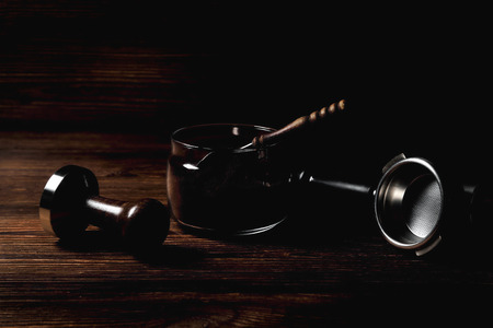 temper portofilter wooden coffee spoon on natural wooden brown background close-up copy spaceの写真素材