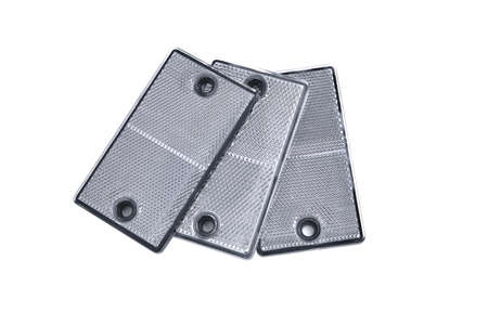 reflectors of white color for designating car trailers and dimensions of objects and cars in the dark, on a white background close-up