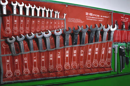 wrenches, set of wrenches, tools on the wall in the workshop, repair shop, close-up