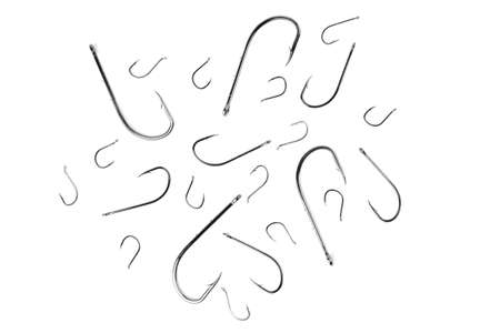 fish hooks of different sizes on a white background, close-upの写真素材
