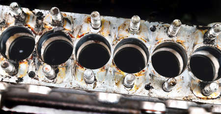 Car fuel pump repair, auto fuel pump disassembly for repair, old car fuel pump on a workbench, disassembled pump body close-up, step by step series of images, selective focusの写真素材