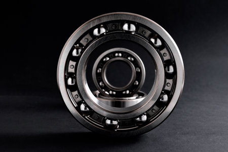 composition of group of ball bearings on black background close-up selective focusの写真素材