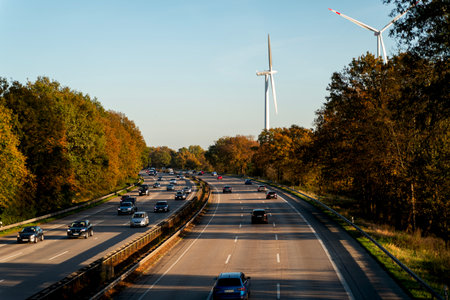 view of autumn highway with cars in side sunlight close-up selective focus