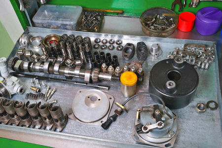 car fuel pump repair, repair parts and accessories, workbench in workshop, truck service, close-up,...