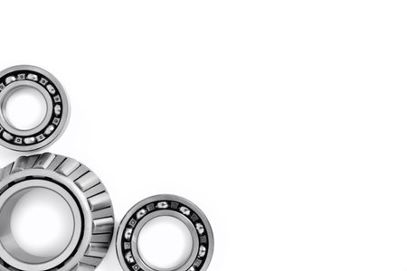 ball bearings on a white background, top view, blank for creativity. Parts for machines and mechanisms in rotation units. Close-up selective focus copy spaceの写真素材