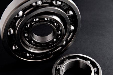 ball bearings in the form of a composite group of several pieces on a black background close-up selective focusの写真素材