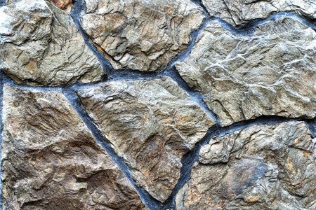 Color stone wall, background, texture, rectangular natural stones of different shades