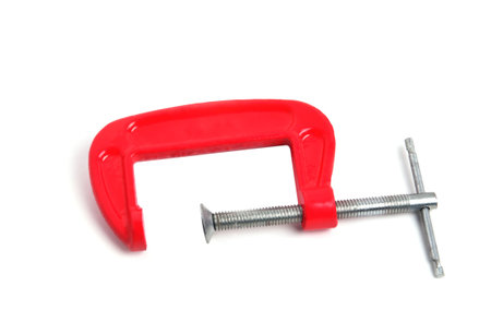 metal clamp red close up on a white background isolate