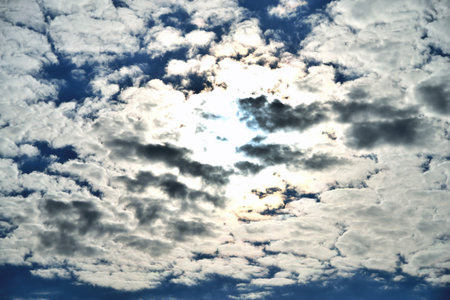 Clouds on the background of bright blue sky, summer day close-up