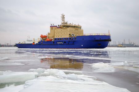 Powerful nuclear icebreaker breaks the ice and frees the path for ships.の写真素材