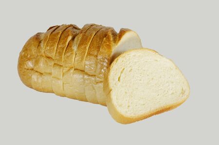 Bakery product. A fresh baguette sliced on the share and is ready for use.