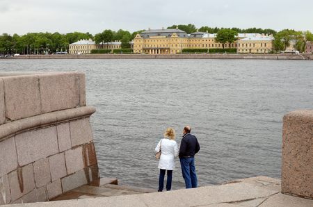 19.05.2016.Russia.Saint-Petersburg.The River Neva.Two people standing on the river Bank.のeditorial素材