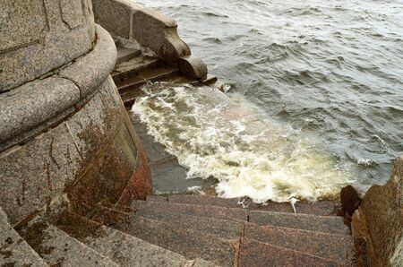 Saint-Petersburg.In the city of the river Neva.Its waters flowing along granite embankments.の写真素材