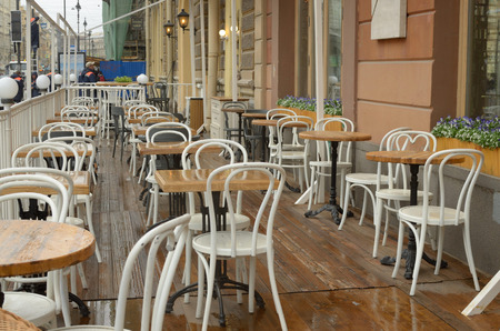 In the summer season in the city on the street opened a lot of cafes for tourists.の写真素材