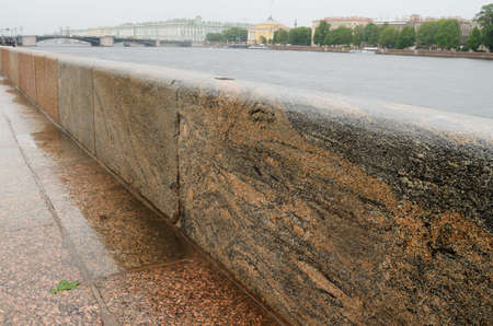 Russia.Saint-Petersburg.Granite slabs of the promenade is especially beautiful during the rain.の写真素材