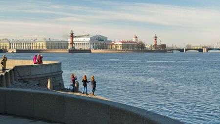 03.04.2016.Russia.Saint-Petersburg.City skyline with tourists on the banks of the Neva.のeditorial素材