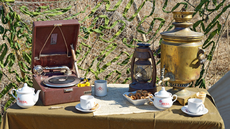 23.04.2016.Russia.Saint-Petersburg.Various items lie on the table.This is a kitchen utensil and the gramophone.のeditorial素材