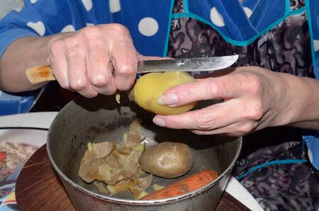 Prepare a winter salad of boiled vegetables in the kitchen.の写真素材