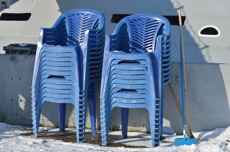 Plastic chairs were collected after the Banquet and carried to the street.の写真素材