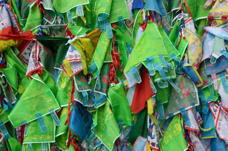 13.03.2016.Russia.Saint-Petersburg.small scraps of colorful fabrics with drawn on them with the words of the Holy prayers.のeditorial素材