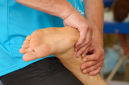 Sports massage therapists help athletes after a marathon race.の写真素材