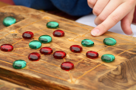 Board game with chips.It develops the human mind and intelligence.