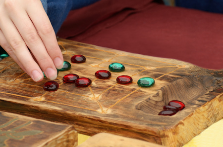 Board game with chips.It develops the human mind and intelligence.