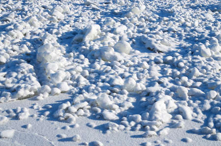 On the ground the snow fell.Its crystals glisten in the sun.の写真素材