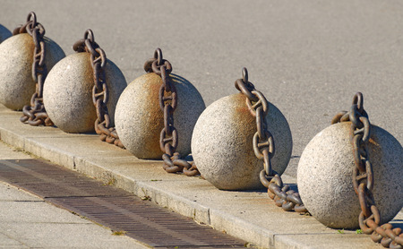 The stone balls had been Le on the pavement.They serve as a decorative fence.の写真素材
