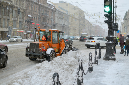 Saint-Petersburg.Russia.12.21.2017.Heavy snowfall in the city.Street cleaning is carried out by special vehicles.のeditorial素材
