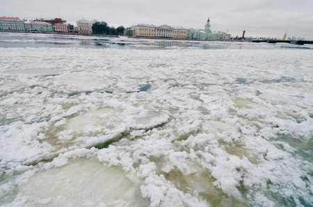 In the city is winter.The river is icebound.Outside the frost and cold.の写真素材