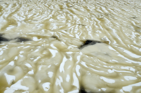 Thick snow on the river.It forms an interesting texture and shape.