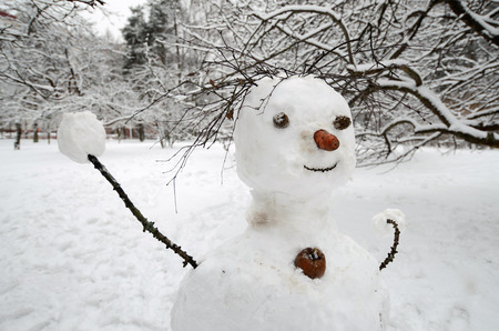 Snowman cobbled together by children.This traditional winter pastime.の写真素材