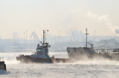 To tow a large tanker in the port for loading.の写真素材