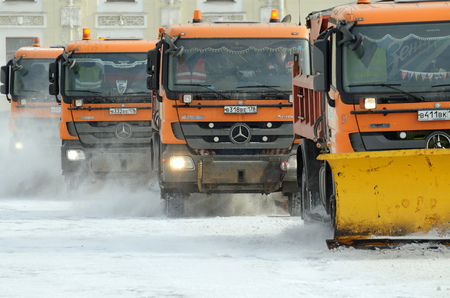 Saint-Petersburg.Russia.March.18.2018.Night in the city the snow fell.His cleaning went snow-removal vehicles.They cleared the roads on the streets of the city.のeditorial素材