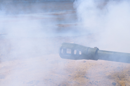 The shot of the projectile from the artillery.Around the exhaust gas from the gunpowder.