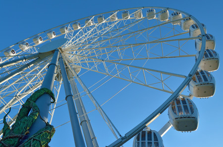 A fragment of the attraction,the Ferris wheel on the background of blue sky.のeditorial素材