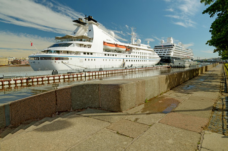 Granite embankment of the river.Nearby is a pier with tourist ships.の写真素材