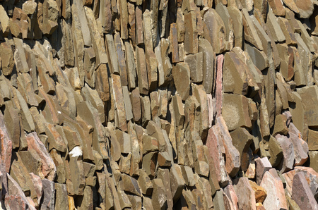 Wall of flat stones.They lie close to each other.の写真素材