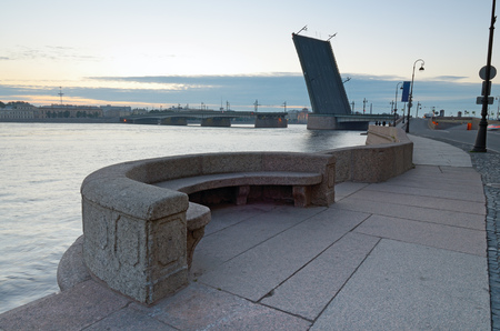 Neva river embankment in St. Petersburg.Morning landscape with raised bridge on the horizon.の写真素材