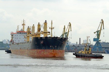 To tow a large tanker in the port for loading.の写真素材