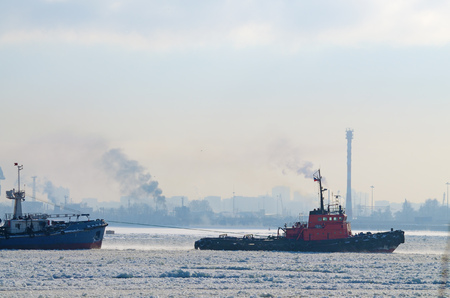 To tow a large tanker in the port for loading.の写真素材